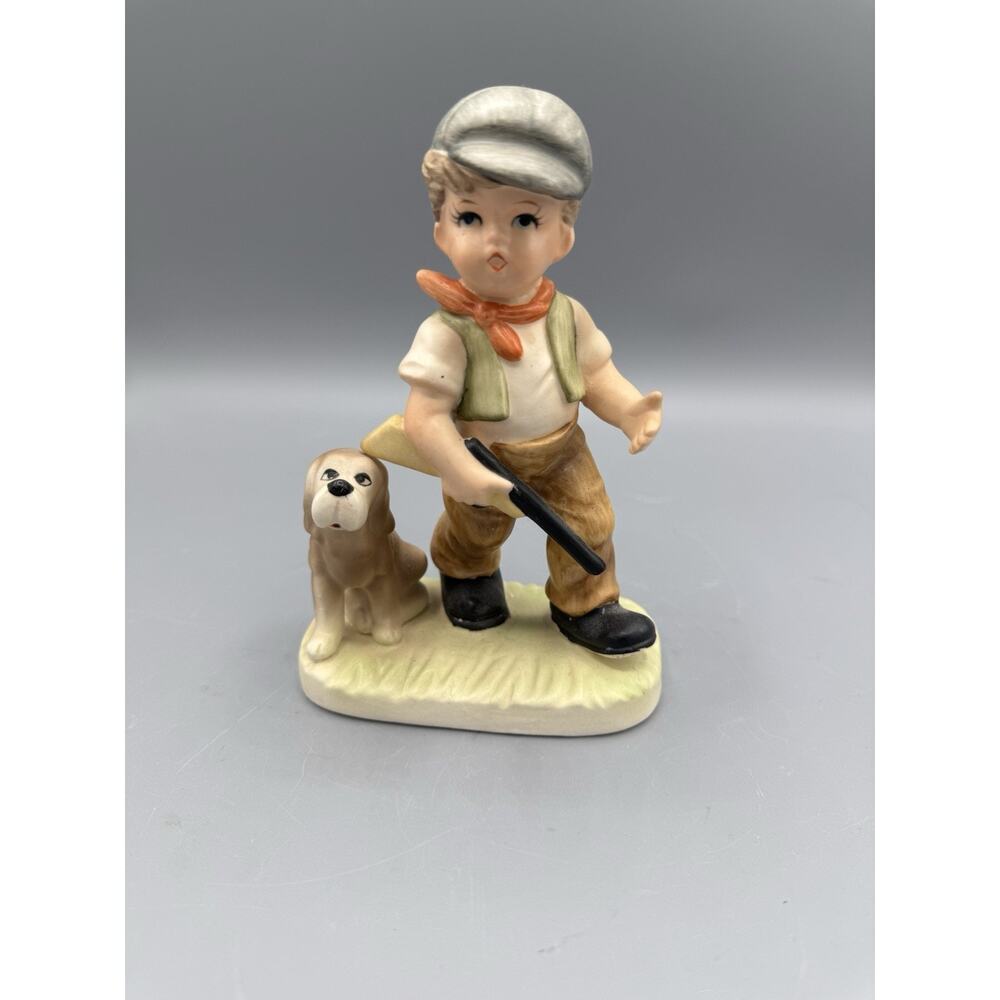 Royal Crown Figurine Of A Boy And His Loyal Dog Hunting, made in Japan.